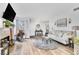 Inviting living room with hardwood floors, neutral walls, and updated decor at 6536 Pleasant Plains Way, Las Vegas, NV 89108