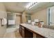 Spacious bathroom with granite countertops, a shower/tub combo and neutral tile flooring at 668 Oakmont Ave # 1715, Las Vegas, NV 89109