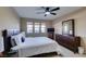 Comfortable bedroom features a ceiling fan, dresser and large windows for plenty of natural light at 668 Oakmont Ave # 1715, Las Vegas, NV 89109