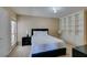 Cozy bedroom features built-in shelving, a ceiling fan and a large window for plenty of natural light at 668 Oakmont Ave # 1715, Las Vegas, NV 89109