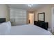 Bedroom with built-in shelving and a dark wood dresser for plenty of bedroom storage space at 668 Oakmont Ave # 1715, Las Vegas, NV 89109