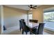 Bright dining room with modern ceiling fan and views of the lush outdoor scenery at 668 Oakmont Ave # 1715, Las Vegas, NV 89109