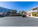 Real estate showing building exteriors with ample parking spaces in a well-maintained complex at 668 Oakmont Ave # 1715, Las Vegas, NV 89109