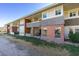Exterior shot showcases condo building's brick facade, multiple units, and landscaped grounds at 668 Oakmont Ave # 1715, Las Vegas, NV 89109