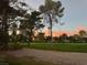 Picturesque golf course at sunset, featuring a mix of greens and trees with buildings in the background at 668 Oakmont Ave # 1715, Las Vegas, NV 89109