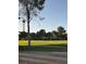 Scenic view of a green space with mature trees and the iconic Stratosphere visible in the background at 668 Oakmont Ave # 1715, Las Vegas, NV 89109