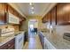 Modern kitchen boasting granite countertops, stainless steel appliances, and an open layout to the dining area at 668 Oakmont Ave # 1715, Las Vegas, NV 89109