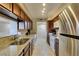Well-appointed kitchen with granite countertops, stainless steel refrigerator, ample cabinet space, and washer/dryer hookups at 668 Oakmont Ave # 1715, Las Vegas, NV 89109