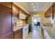 The open kitchen is bright, with granite counters, stainless appliances, and a direct view to the dining room at 668 Oakmont Ave # 1715, Las Vegas, NV 89109
