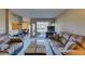 Spacious living room with access to the outdoor patio and views of the community green space at 668 Oakmont Ave # 1715, Las Vegas, NV 89109