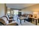 Cozy living room with a large sliding glass door for exterior view and natural light at 668 Oakmont Ave # 1715, Las Vegas, NV 89109