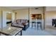 Comfortable living room showcasing open access to the bar and adjacent bedroom space at 668 Oakmont Ave # 1715, Las Vegas, NV 89109