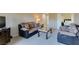 Cozy living room with plush seating and neutral tones, seamlessly flowing to bedroom at 668 Oakmont Ave # 1715, Las Vegas, NV 89109