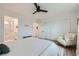 Bright bedroom features a ceiling fan, large closet, and a view of an en-suite bathroom at 709 Pickled Pepper Pl, Henderson, NV 89011