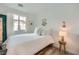 Bedroom with a window, natural light, and white bedding at 709 Pickled Pepper Pl, Henderson, NV 89011