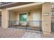 Cozy front porch with seating, decorative railing, and a well-lit entrance to welcome you home at 709 Pickled Pepper Pl, Henderson, NV 89011
