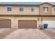 Attached garage with a paved driveway, providing convenient parking and easy access to the home at 709 Pickled Pepper Pl, Henderson, NV 89011
