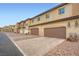 Street view of garages, ample parking, and well-kept exteriors in a desirable community at 709 Pickled Pepper Pl, Henderson, NV 89011