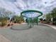Community playground featuring a green net structure and safety surfacing, perfect for outdoor activities at 709 Pickled Pepper Pl, Henderson, NV 89011
