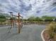 Community playground with wood frame and rope climbing structure for active, outdoor fun at 709 Pickled Pepper Pl, Henderson, NV 89011