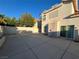 Spacious backyard patio with privacy walls and a sliding glass door at 8704 Autumn Wreath Ave, Las Vegas, NV 89129