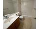 Traditional bathroom with tiled floors, vanity with sink, and shower-tub combo at 8704 Autumn Wreath Ave, Las Vegas, NV 89129