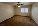 This bedroom features a ceiling fan, window, and neutral carpeting at 8704 Autumn Wreath Ave, Las Vegas, NV 89129