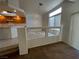 Bright dining area with tile flooring, modern lighting, and large windows offering natural light at 8704 Autumn Wreath Ave, Las Vegas, NV 89129