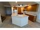 Bright open kitchen with tiled floors and countertops plus white appliances and wooden cabinets at 8704 Autumn Wreath Ave, Las Vegas, NV 89129
