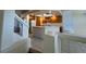 Bright kitchen, showing the open layout, skylight, white appliances and wooden cabinets at 8704 Autumn Wreath Ave, Las Vegas, NV 89129