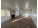 Inviting living room with fireplace, ceiling fan, and sliding doors for easy outdoor access at 8704 Autumn Wreath Ave, Las Vegas, NV 89129