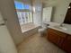Relaxing main bathroom with soaking tub, separate shower, and vanity with ample counter space at 8704 Autumn Wreath Ave, Las Vegas, NV 89129