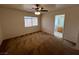 Bright main bedroom with ceiling fan and ensuite bathroom at 8704 Autumn Wreath Ave, Las Vegas, NV 89129