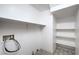 The laundry room has shelving and designer tile flooring ready for your washer and dryer at 8798 Tom Noon Ave # 103, Las Vegas, NV 89178