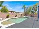 Large backyard with a pool, patio and privacy wall, perfect for outdoor living at 9408 Ironsend St, Las Vegas, NV 89143