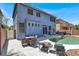 Backyard featuring a pool, lounge chairs and outdoor seating for entertaining guests at 9408 Ironsend St, Las Vegas, NV 89143