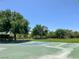 Outdoor basketball court surrounded by lush green space at 9408 Ironsend St, Las Vegas, NV 89143