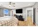 Cozy bedroom with hardwood flooring, ceiling fan, and neutral decor at 9408 Ironsend St, Las Vegas, NV 89143