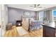 Nicely decorated bedroom with hardwood floors, ceiling fan, and neutral walls at 9408 Ironsend St, Las Vegas, NV 89143
