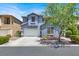 Charming two-story home with a well-maintained front yard and attached two-car garage at 9408 Ironsend St, Las Vegas, NV 89143