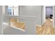 Light-filled hallway with hardwood flooring and neutral paint, creating a welcoming and airy atmosphere at 9408 Ironsend St, Las Vegas, NV 89143