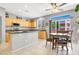 Bright kitchen showcasing granite countertops, breakfast bar and sliding glass doors at 9408 Ironsend St, Las Vegas, NV 89143