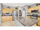 Spacious kitchen featuring a large center island, stainless steel appliances, and walk-in pantry at 9408 Ironsend St, Las Vegas, NV 89143