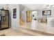 Open-concept living area featuring tile flooring, a staircase, and stylish décor at 9408 Ironsend St, Las Vegas, NV 89143