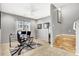 Well-lit office space with tile flooring and a modern desk setup at 9408 Ironsend St, Las Vegas, NV 89143