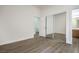 Bedroom featuring wood-look floors and an ensuite bathroom at 9421 Wisdom Valley Ave, Las Vegas, NV 89149