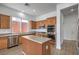 Kitchen featuring stainless steel appliances, wood cabinets, and a central island at 9421 Wisdom Valley Ave, Las Vegas, NV 89149