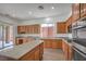 Modern kitchen features stainless steel appliances, granite countertops, and ample cabinet space at 9421 Wisdom Valley Ave, Las Vegas, NV 89149