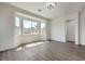 This open living space offers a large bay window, recessed lighting, and new flooring at 9421 Wisdom Valley Ave, Las Vegas, NV 89149