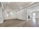 Spacious living room features wood-look floors and modern recessed lighting at 9421 Wisdom Valley Ave, Las Vegas, NV 89149